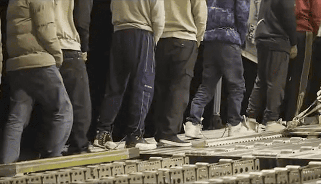 Migrant deported in chains